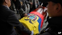 The remains of slain presidential candidate Fernando Villavicencio arrive at Camposanto Monteolivo cemetery for burial in Quito, Ecuador, Aug. 11, 2023. 