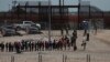 FILE - Migrants line up after being detained by U.S. authorities at the U.S.-Mexico border in Ciudad Juarez, Mexico, April 30, 2023. 