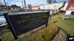 FILE — A sign for toxicologist questions is displayed after a Norfolk Southern derailment in East Palestine, Ohio, Feb. 9, 2023.