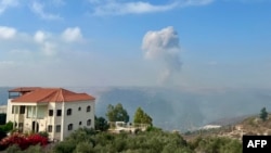 Smoke billows from an area targeted by an Israeli airstrike in the southern Lebanese village of Qsair on Aug. 25, 2024.