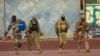 FILE - This undated photo from the French military shows three Russian mercenaries, right, in Mali. Russia's Wagner Group, a private military company, has played a key role in Ukraine fighting and also deployed personnel to the Middle East and Africa.