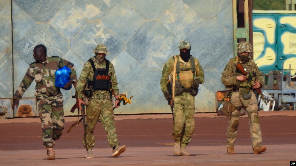 This undated photo from the French military shows three Russian mercenaries, right, in Mali. Russia's Wagner Group, a private military company, has played a key role in Ukraine fighting and also deployed personnel to the Middle East and Africa.
