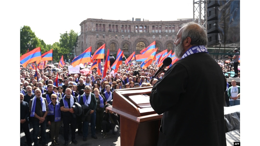 Protest leader Archbishop Bagrat Galstanyan addresses demonstrators during a rally to demand Prime Minister Nikol Pashinyan's resignation over land transfer to neighbouring Azerbaijan, at the central Republic Square in Yerevan, May 26, 2024.