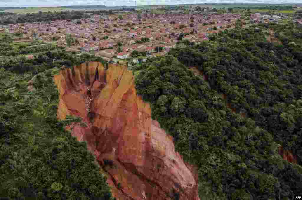 Aerial view of erosions in Buriticupu, Maranhao state, Brazil, taken on April 21, 2023. The city of 70,000 is suffering from the advance of &quot;vocorocas&quot; - &quot;torn earth&quot; in the indigenous Tupi-Guarani language - erosions that begin as small cracks in the ground and grow into large craters that, seen from the air, look like advancing canyons swallowing up chunks of the town.&nbsp;