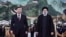 In this photo released by Xinhua News Agency, visiting Iranian President Ebrahim Raisi, right, walks with Chinese President Xi Jinping after reviewing an honor guard during a welcome ceremony at the Great Hall of the People in Beijing, Feb. 14, 2023