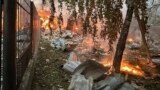 In this photo provided by the Kyiv City Hall Press Service, a fire following a Russian rocket attack is seen in Kyiv, Ukraine, Sept. 21, 2023.