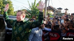 Elon Musk, chief executive officer of SpaceX and Tesla, reacts to the media as he arrives to launch SpaceX's Starlink internet service in Indonesia at a sub district community health center in Denpasar, Bali, May 19, 2024. 