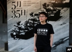 Lit Ming-wai, chairwoman of a now-disbanded art group that used to stage drama performances related to the crackdown in Hong Kong, poses during an interview with The AP in Taipei, Taiwan, Thursday, June 1, 2023.