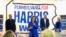 Democratic presidential nominee Vice President Kamala Harris speaks as second gentleman Doug Emhoff, from left, Democratic vice presidential nominee Minnesota Gov. Tim Walz and his wife Gwen Walz listen at a campaign event, Aug. 18, 2024, in Rochester, Pennsylvania. 