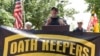 FILE - Stewart Rhodes, founder of the Oath Keepers, center, speaks during a rally outside the White House in Washington, June 25, 2017. Rhodes has been sentenced to 18 years in prison for his role in the Jan. 6, 2021, attack on the U.S. Capitol.