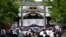 FILE - People queue to pay respects to the war dead at Yasukuni Shrine, Aug. 15, 2022, in Tokyo. 