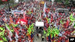 People attend a May Day, or Labor Day, rally in Sao Paulo, Brazil, Monday, May 1, 2023.