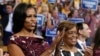 FILE - First lady Michelle Obama, left, and her mother, Marian Robinson, react as Ret. Navy Admiral John B. Nathman speaks to delegates at the Democratic National Convention in Charlotte, NC, Sept. 6, 2012.