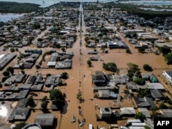 FILE - Sky view of floods in Eldorado do Sul, Rio Grande do Sul state, Brazil, taken on May 9, 2024. It has been called the worst natural disaster to hit the area. (Photo by Nelson ALMEIDA / AFP)