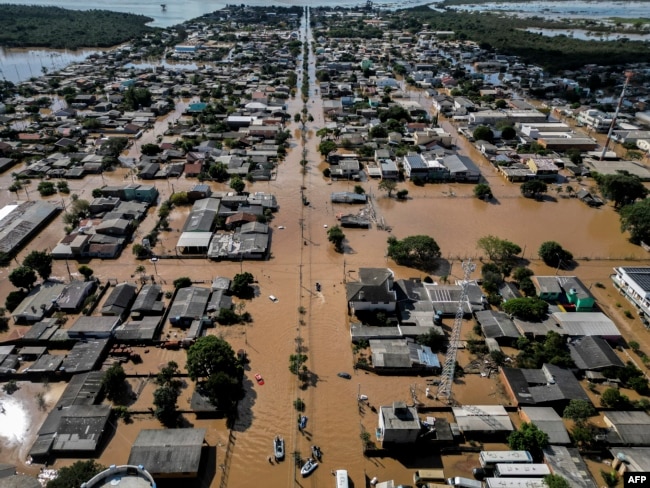 FILE - Sky view of floods in Eldorado do Sul, Rio Grande do Sul state, Brazil, taken on May 9, 2024. It has been called the worst natural disaster to hit the area. (Photo by Nelson ALMEIDA / AFP)