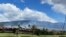 Smoke rises in the hills above the Kaanapali resort hotel area of Lahaina, Hawaii, August 26, 2023. A brush fire Saturday caused Maui to evacuate residents from a neighborhood of Lahaina.