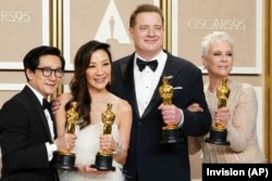 Ke Huy Quan, from left, Michelle Yeoh, Brendan Fraser and Jamie Lee Curtis pose with their awards in the press room at the Oscars on Sunday, March 12, 2023, at the Dolby Theatre in Los Angeles. Brendan Fraser, third from left, won best performance by an actor in a leading role for "The Whale." Ke Huy Quan, from left, Michelle Yeoh and Jamie Lee Curtis all won for their leading and supporting roles in "Everything Everywhere All at Once." (Photo by Jordan Strauss/Invision/AP)