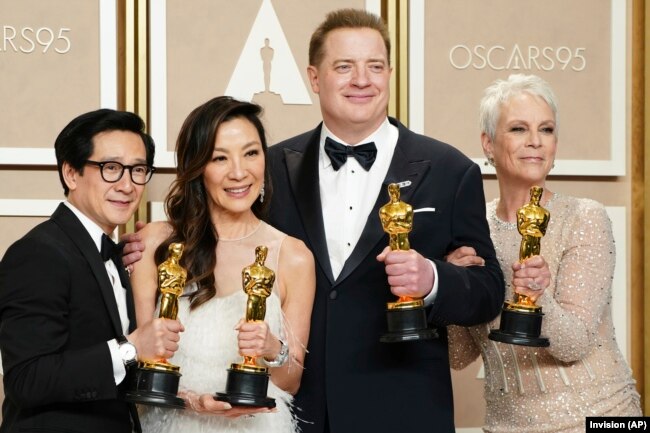 Ke Huy Quan, from left, Michelle Yeoh, Brendan Fraser and Jamie Lee Curtis pose with their awards in the press room at the Oscars on Sunday, March 12, 2023, at the Dolby Theatre in Los Angeles. Brendan Fraser, third from left, won best performance by an actor in a leading role for "The Whale." Ke Huy Quan, from left, Michelle Yeoh and Jamie Lee Curtis all won for their leading and supporting roles in "Everything Everywhere All at Once." (Photo by Jordan Strauss/Invision/AP)