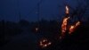 This photograph shows burning vegetation next to a road near Frontignan as a fire hit 300 hectares in the Herault department in southern France, Aug. 18, 2024.
