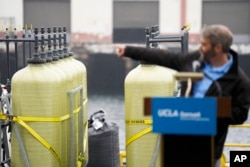 Thomas Traynor of UCLA says the technique can remove carbon dioxide from seawater and produce hydrogen, a green energy fuel, in the process. (AP Photo/Ashley Landis)