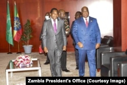 Zambian President Hakainde Hichilema, left, and DRC President Felix Tshisekedi are seen during bilateral talks to resolve the Kasumbalesa border crisis on the sidelines of the African Union Summit in Addis Ababa, Ethiopia, Feb. 18, 2023.