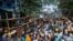 Doctors, paramedics and medical students gather as they attend a protest against what they say was rape and murder of a trainee doctor, inside the premises of R G Kar Medical College and Hospital in Kolkata, India, Aug. 13, 2024. 
