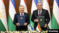 Uzbek President Shavkat Mirziyoyev, left, and Tajik President Emomali Rahmon pose after signing documents in Dushanbe, Tajikistan, on April 18, 2024. Tajikistan has been under one man's rule for over 30 years. The last time the leader changed in Uzbekistan was in 2016.