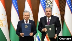Presidents Shavkat Mirziyoyev, left, and Emomali Rahmon are seen after signing the Uzbekistan-Tajikistan Alliance Treaty and other strategic documents aiming to strengthen bilateral ties as well as cooperation on regional issues, Dushanbe, April 18, 2024. (president.uz)