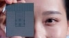 FILE - A Kunpeng 920 chip is displayed during a ceremony in Shenzhen, China, Jan. 7, 2019. China says foreign access to an academic database with information in such fields as politics, the humanities and technology will be limited starting April 1, 2023.
