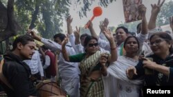 Supporters of India's main opposition Congress party celebrate after the initial poll results in Karnataka elections at the party headquarters, in New Delhi, May 13, 2023.