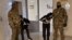 In this photo taken from video released by Investigative Committee of Russia on March 24, 2024, suspects in the Crocus City Hall shooting on Friday are escorted inside the Russian Investigative Committee headquarters in Moscow, Russia. 