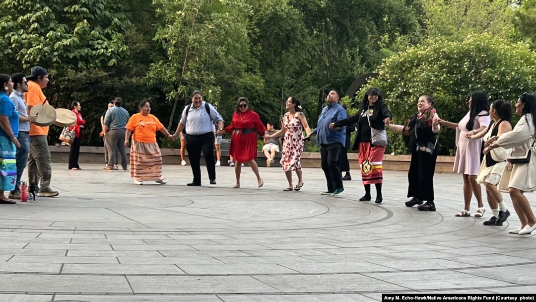 Photo shows Native Americans and allies in an impromptu celebration in Washington D.C. on hearing that the U.S. Supreme Court ruled to uphold ICWA.