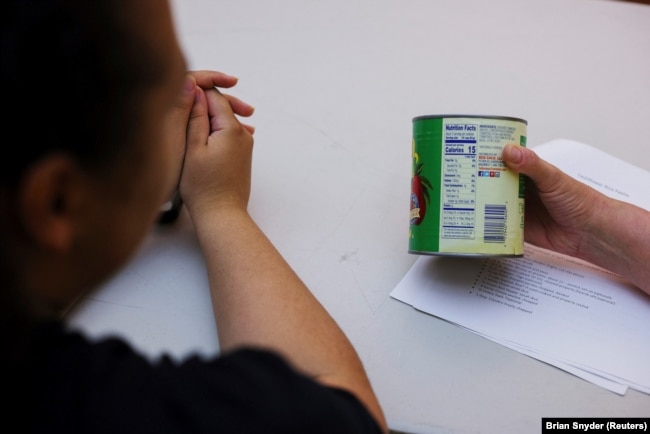 Jelainie learns to read food labels at the Holyoke Health Center in Holyoke, Massachusetts, June 11, 2024. (REUTERS/Brian Snyder)