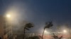This video grab from the Twitter page of James Reynolds @EarthUncutTV shows strong winds and precipitation from Typhoon Mawar blowing across Tumon Bay, Guam on May 24, 2023.