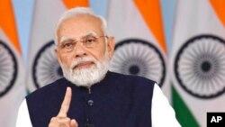 Indian Prime Minister Narendra Modi addresses G-20 atendees in Bangaluru, through a video message from New Delhi, India, Feb. 24, 2023. (Indian Press Information Bureau via AP)