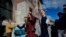 FILE - Youth plaintiffs in the climate change lawsuit, Held vs. Montana, arrive at the Lewis and Clark County Courthouse, June 20, 2023, in Helena, Montana, for the final day of the trial. 