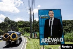 A view of placards of the anti-graft presidential candidate of the Semilla political party Bernardo Arevalo, and presidential candidate of the National Unity of Hope (UNE) political party Sandra Torres, in Guatemala City, Guatemala, Aug. 19, 2023.