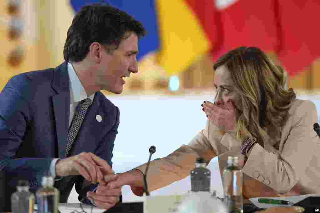 Italian Prime Minister Giorgia Meloni, right, talks to Canada&#39;s Prime Minister Justin Trudeau as they attend the Partnership for global infrastructure and investment event at the G7 summit in Borgo Egnazia, Italy.