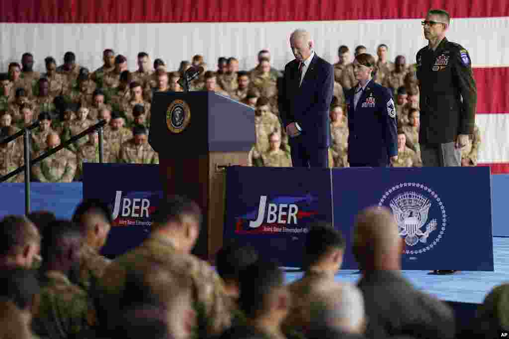 President Joe Biden stands during the playing of &quot;Taps,&quot; at Joint Base Elmendorf-Richardson to mark the anniversary of the Sept. 11, 2001, terrorist attacks, in Anchorage, Alaska.