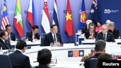 FILE - Laos' Prime Minister Sonexay Siphandone, center, gives an address to the Leaders’ Plenary during the 2024 ASEAN-Australia Special Summit in Melbourne, Australia, March 6, 2024.