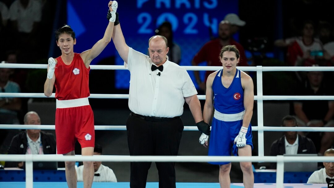 Taiwan's Lin Yu-ting, left, celebrates after defeating Turkey's Esra Yildiz in their women's 57 kg semifinal boxing match at the 2024 Summer Olympics, Aug. 7, 2024, in Paris.
