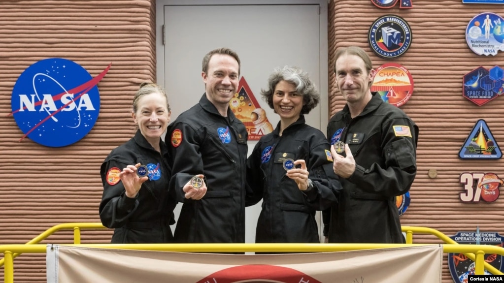 This image shows the CHAPEA leaving the Mars habitat mission July 6, 2024, at NASA’s Johnson Space Center in Houston. From left: Kelly Haston, Nathan Jones, Anca Selariu, and Ross Brockwell. (NASA/Josh Valcarcel)