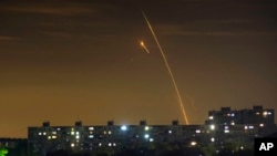 Russian rockets launching against Ukraine from Russia's Belgorod region are seen at dawn in Kharkiv, Ukraine, May 14, 2023. 
