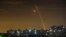 Russian rockets launching against Ukraine from Russia's Belgorod region are seen at dawn in Kharkiv, Ukraine, May 14, 2023. 