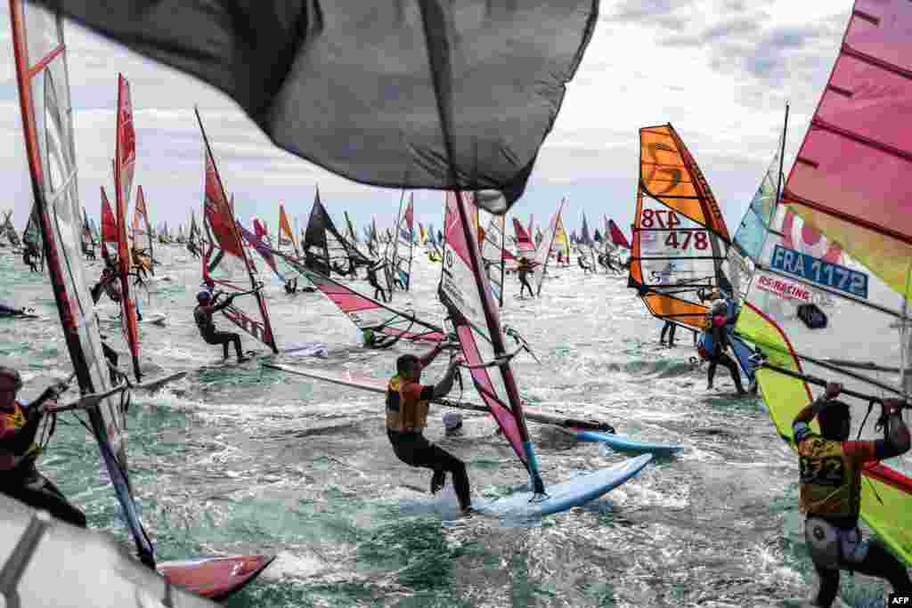Over 1,000 windsurfers take the start of the 21th edition of the Defi Wind in the Mediterranean Sea, off the coast of Gruissan in southern France.