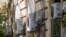Air conditioning external units are seen on the wall of a building in Rome, July 25, 2023. 