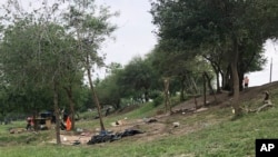 About two dozen makeshift tents were set ablaze and destroyed across the border from Texas this week, witnesses said April 21, 2023. (AP Photo/Valerie Gonzalez)