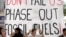 Activists demonstrate with a sign that reads "Don't fail us phase out fossil fuels" at the COP28 U.N. Climate Summit, Dec. 12, 2023, in Dubai, United Arab Emirates. 