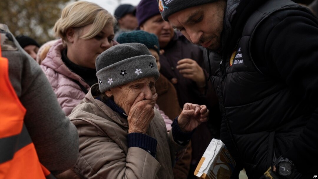 A woman reacts after receiving food aid from World Central Kitchen in Kherson, Ukraine, Nov. 17, 2022. The image was part of a series of images by Associated Press photographers that was a finalist for the 2023 Pulitzer Prize for Feature Photography. The AP got the nod for Breaking News Photography.