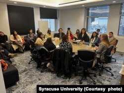 Students meet with business representatives at Syracuse University. ( Photo courtesy of Syracuse University)